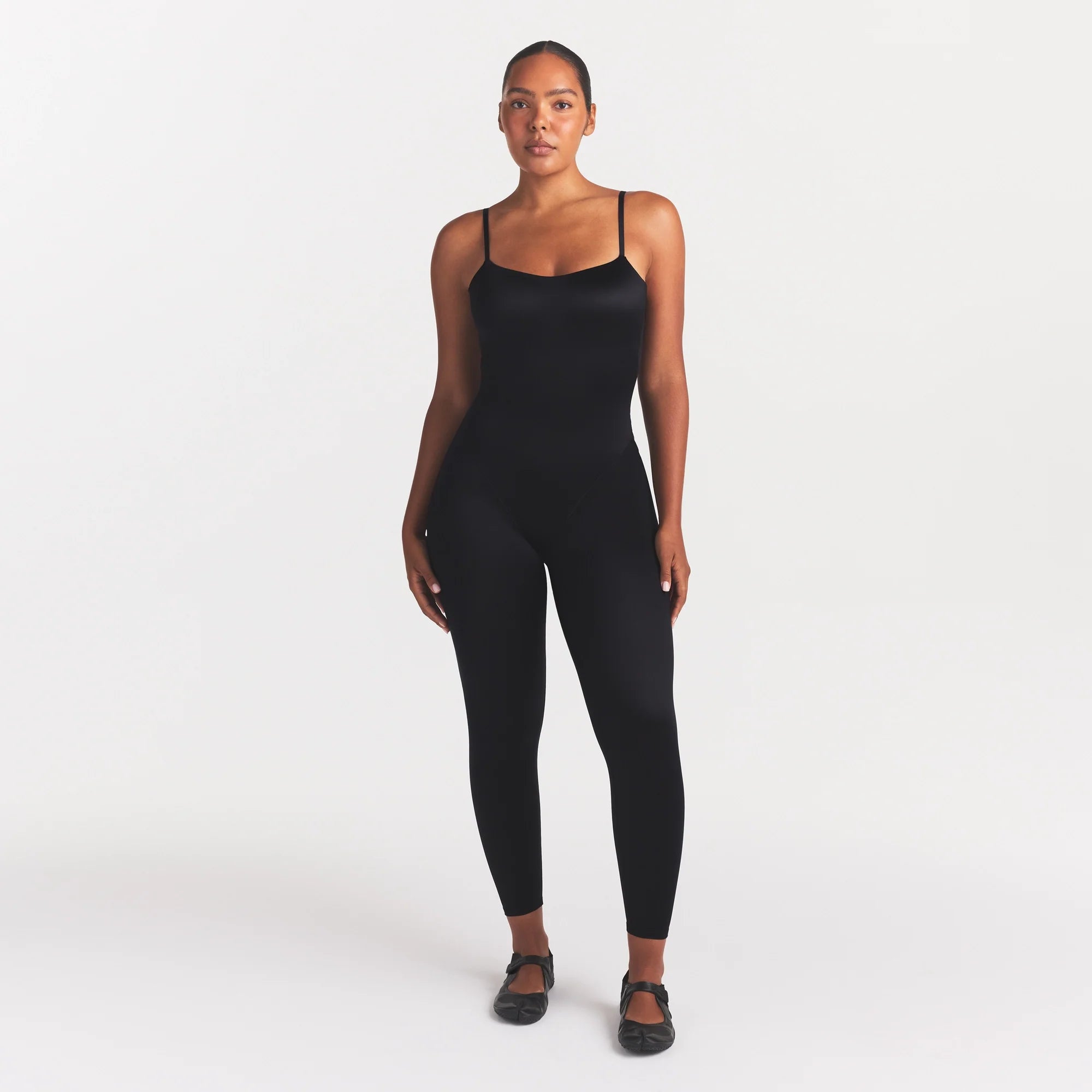 NikeSKIMS SATIN SHINE CAMI 26" ONE PIECE | OBSIDIAN ON A MODEL FRONT VIEW