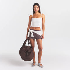 NikeSKIMS RIBBED SEAMLESS CAMI TANK | IVORY ON A MODEL FRONT VIEW @ | FOCUS: 0.0, 1.0, 0.9