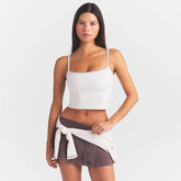 NikeSKIMS RIBBED SEAMLESS CAMI TANK | IVORY ON A MODEL SIDE VIEW @ | FOCUS: 0.0, 1.0, 0.9