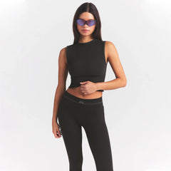 NikeSKIMS RIBBED SEAMLESS MUSCLE TANK | OBSIDIAN ON A MODEL SIDE VIEW @ | FOCUS: 0.0, 1.0, 0.9