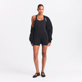 NikeSKIMS MATTE AND SHINE RACERBACK 5" ONE PIECE | OBSIDIAN/IGNEOUS ON A MODEL FRONT VIEW @ | FOCUS: 0.0, 1.0, 0.9