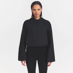 WOVEN COTTON HALF ZIP PULLOVER | ONYX ON A MODEL SIDE VIEW @ | FOCUS: 0.0, 1.0, 0.9