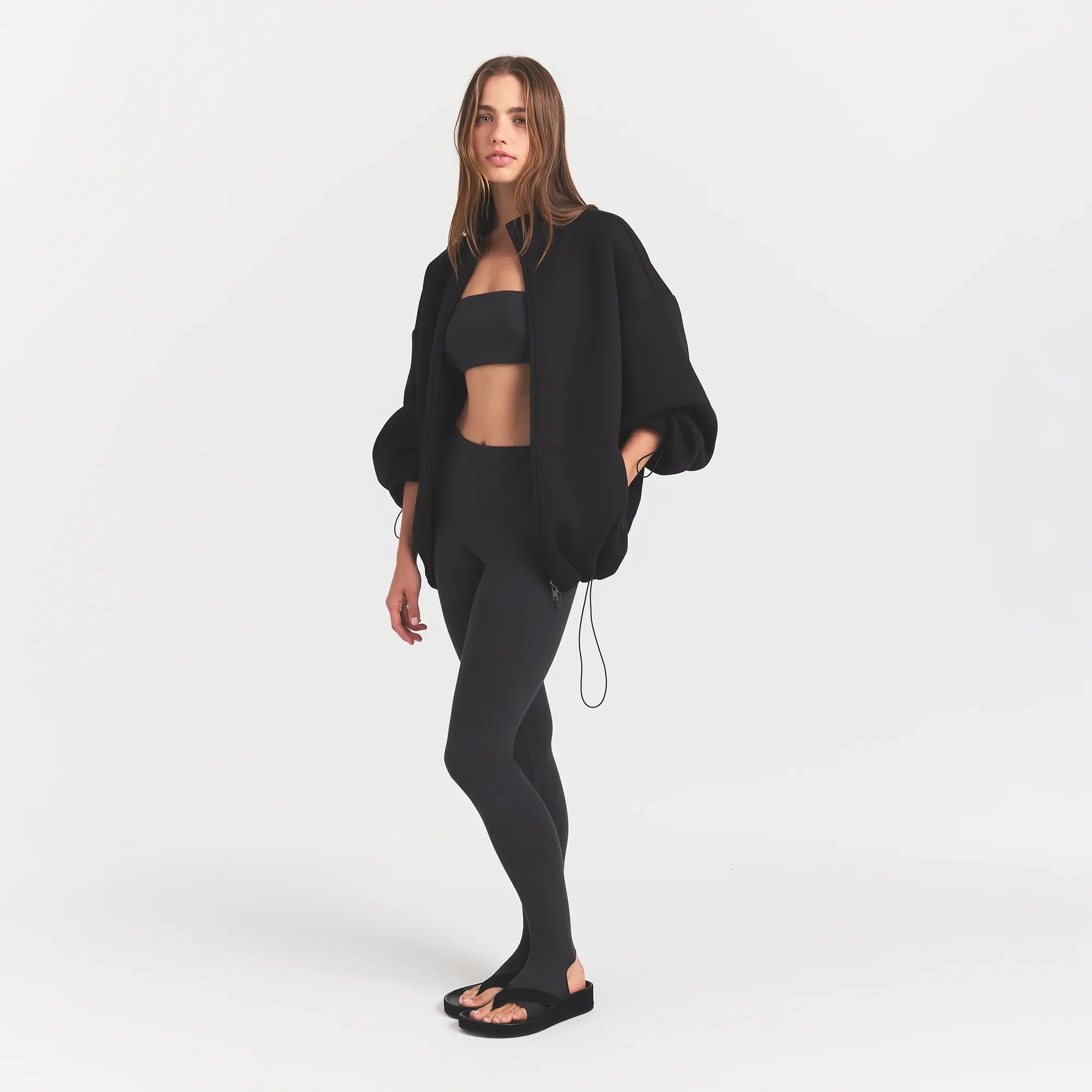NEOPRENE OUTERWEAR OVERSIZED MOCK NECK JACKET | OBSIDIAN ON A MODEL SIDE VIEW @ | FOCUS: 0.0, 1.0, 0.9