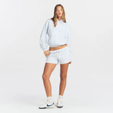 COTTON FLEECE CLASSIC HOODIE | LIGHT HEATHER GREY ON A MODEL FRONT VIEW @ | FOCUS: 0.0, 1.0, 0.9