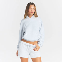 COTTON FLEECE CLASSIC HOODIE | LIGHT HEATHER GREY ON A MODEL FRONT VIEW @ | FOCUS: 0.0, 1.0, 0.9