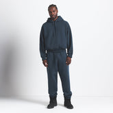 HEAVYWEIGHT FLEECE MENS HOODIE | NAVY ON A MODEL FRONT VIEW @ | FOCUS: 0.0, 1.0, 0.9