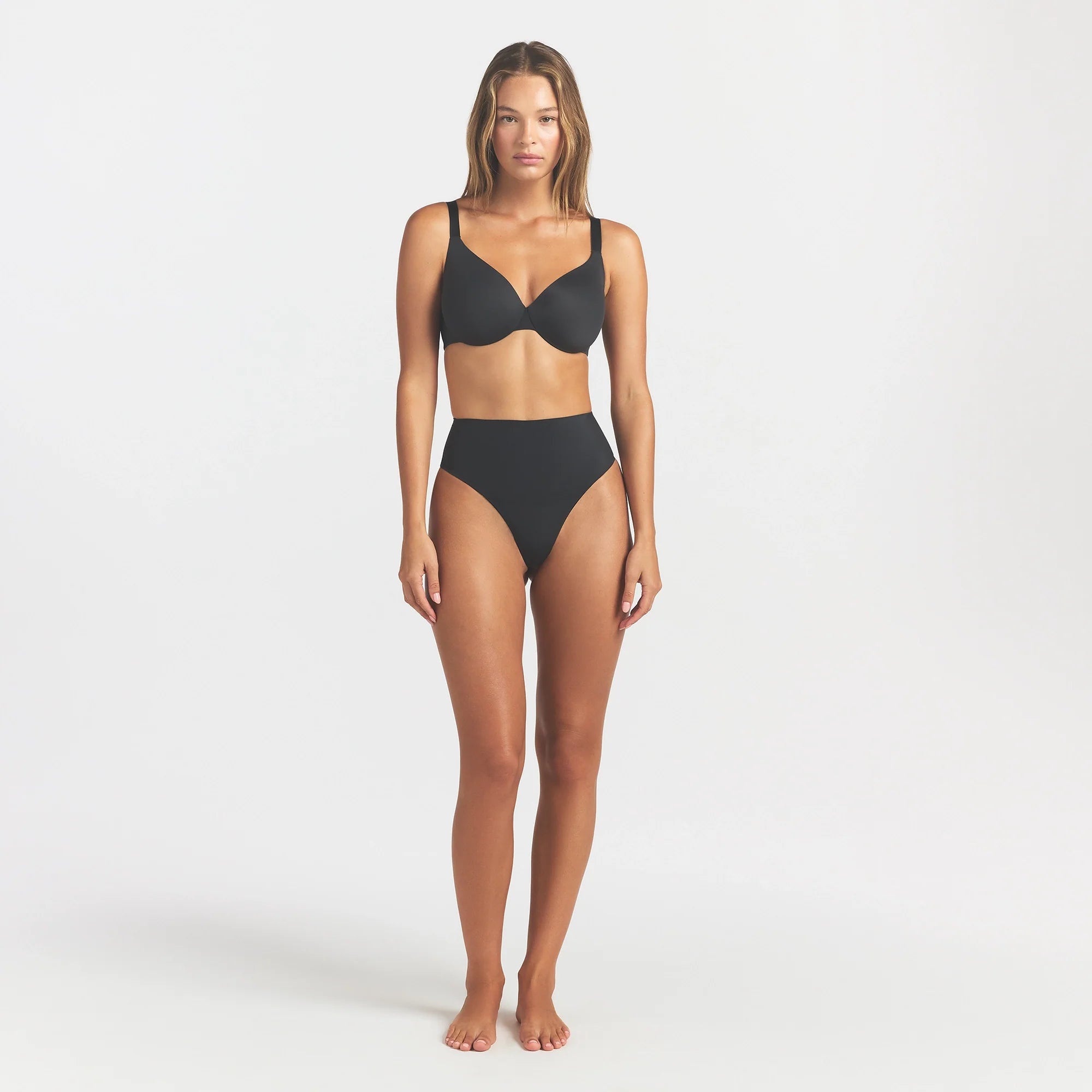 SMOOTHING INTIMATES HIGH-WAISTED THONG | ONYX ON A MODEL FRONT VIEW @ | FOCUS: 0.0, 1.0, 0.9