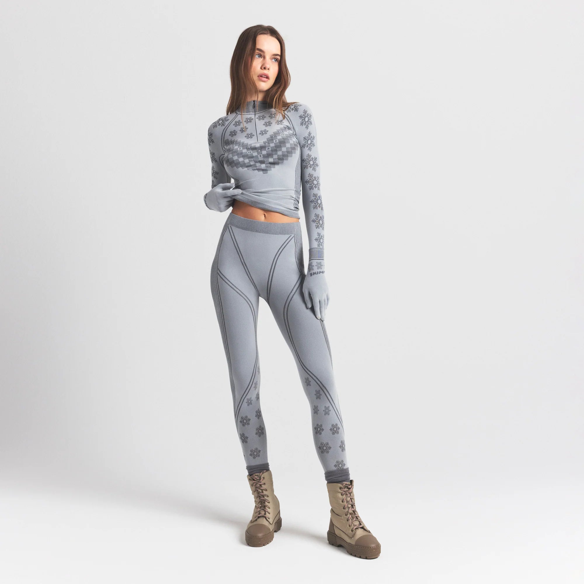 SKIMS FIRST LAYERS LEGGING | MIRROR WINTER FAIR ISLE ON A MODEL FRONT VIEW @ | FOCUS: 0.0, 1.0, 0.9
