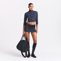 NikeSKIMS AIRY FOLDOVER SKORT | DEEP ROYAL ON A MODEL FRONT VIEW @ | FOCUS: 0.0, 1.0, 0.9