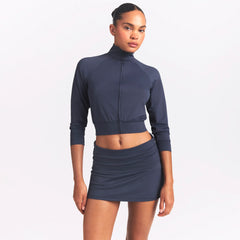 NikeSKIMS AIRY FOLDOVER SKORT | DEEP ROYAL ON A MODEL SIDE VIEW @ | FOCUS: 0.0, 1.0, 0.9