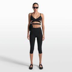 NikeSKIMS MATTE WRAP FRONT BRA | OBSIDIAN ON A MODEL FRONT VIEW @ | FOCUS: 0.0, 1.0, 0.9