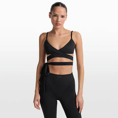 NikeSKIMS MATTE WRAP FRONT BRA | OBSIDIAN ON A MODEL FRONT VIEW @ | FOCUS: 0.0, 1.0, 0.9
