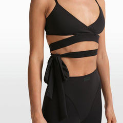 NikeSKIMS MATTE WRAP FRONT BRA | OBSIDIAN ON A MODEL FRONT VIEW @ | FOCUS: 0.0, 1.0, 0.9