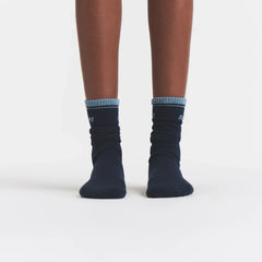RIBBED CREW LOGO SOCK | NAVY AND KYANITE ON A MODEL | FOCUS: 0.0, 1.0, 0.9