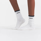 RIBBED CREW LOGO SOCK | SNOW AND ONYX ON A MODEL | FOCUS: 0.0, 1.0, 0.9