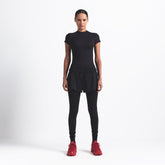 NikeSKIMS MATTE PADDED BABY TEE | OBSIDIAN ON A MODEL FRONT VIEW @ | FOCUS: 0.9, 0.1, 0.7