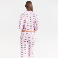 SKIMS SLEEP LONG SLEEVE BUTTON UP SET | PEONY BUTTERFLY PRINT ON A MODEL SIDE VIEW @ | FOCUS: 0.0, 1.0, 0.9