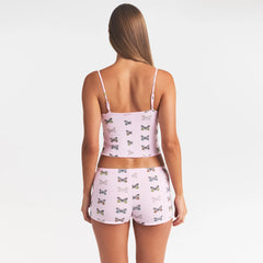 SKIMS SLEEP CAMI SET | PEONY BUTTERFLY PRINT ON A MODEL SIDE VIEW @ | FOCUS: 0.0, 1.0, 0.9