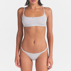 LIGHTWEIGHT COTTON LOGO PICOT THONG | LIGHT HEATHER GREY ON A MODEL SIDE VIEW | FOCUS: 0.0, 1.0, 0.9