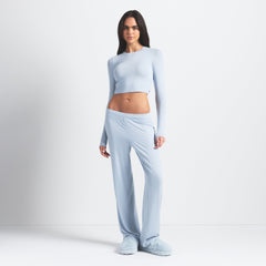 SKIMS SLEEP SUPER CROPPED LONG SLEEVE | ZEN BLUE ON A MODEL FRONT VIEW @ | FOCUS: 0.0, 1.0, 0.9