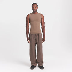 FITS EVERYBODY MENS SLIM TANK | UMBER ON A MODEL FRONT VIEW @ | FOCUS: 0.0, 1.0, 0.9