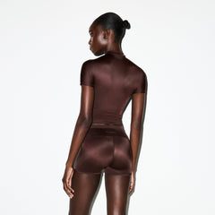 NikeSKIMS SHINE SHORT SLEEVE MOCK NECK TOP | PHOENIX ON A MODEL SIDE VIEW @ | FOCUS: 0.0, 1.0, 0.9