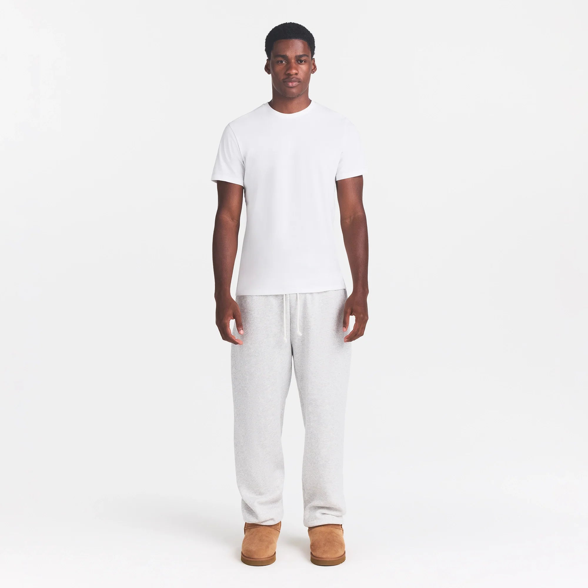 SKIMS COTTON MENS CLASSIC T-SHIRT | CHALK ON A MODEL FRONT VIEW @ | FOCUS: 0.0, 1.0, 0.9