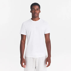 SKIMS COTTON MENS CLASSIC T-SHIRT | CHALK ON A MODEL FRONT VIEW @ | FOCUS: 0.0, 1.0, 0.9