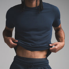 SKIMS COTTON MENS CLASSIC T-SHIRT | NAVY ON A MODEL SIDE VIEW | FOCUS: 0.0, 1.0, 0.9