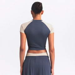 NikeSKIMS MATTE AND SHINE CREWNECK CROP SHORT SLEEVE | DEEP ROYAL/STONE ON A MODEL SIDE VIEW @ | FOCUS: 0.0, 1.0, 0.9