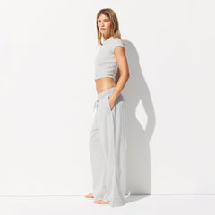 COTTON JERSEY WIDE LEG PANT | LIGHT HEATHER GREY ON A MODEL SIDE VIEW @ | FOCUS: 0.0, 1.0, 0.9