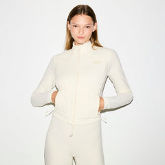 OUTDOOR FLEECE FITTED JACKET | ECRU ON A MODEL SIDE VIEW @ | FOCUS: 0.0, 1.0, 0.9