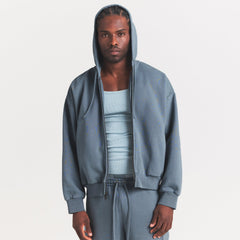 HEAVYWEIGHT FLEECE MENS ZIP UP HOODIE | KYANITE ON A MODEL SIDE VIEW @ | FOCUS: 0.0, 1.0, 0.9