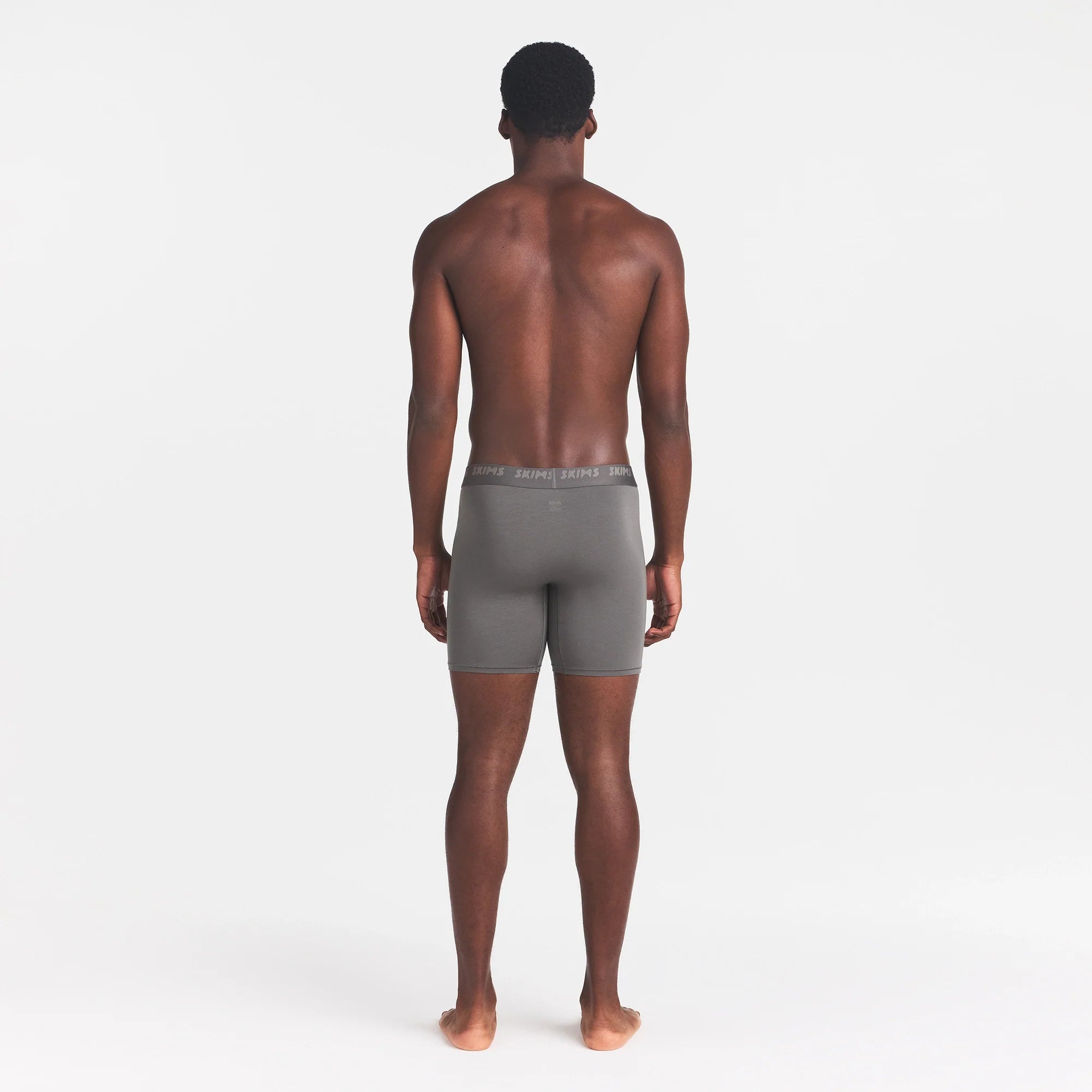 SKIMS STRETCH MENS 5" BOXER BRIEF | GUNMETAL ON A MODEL BACK VIEW