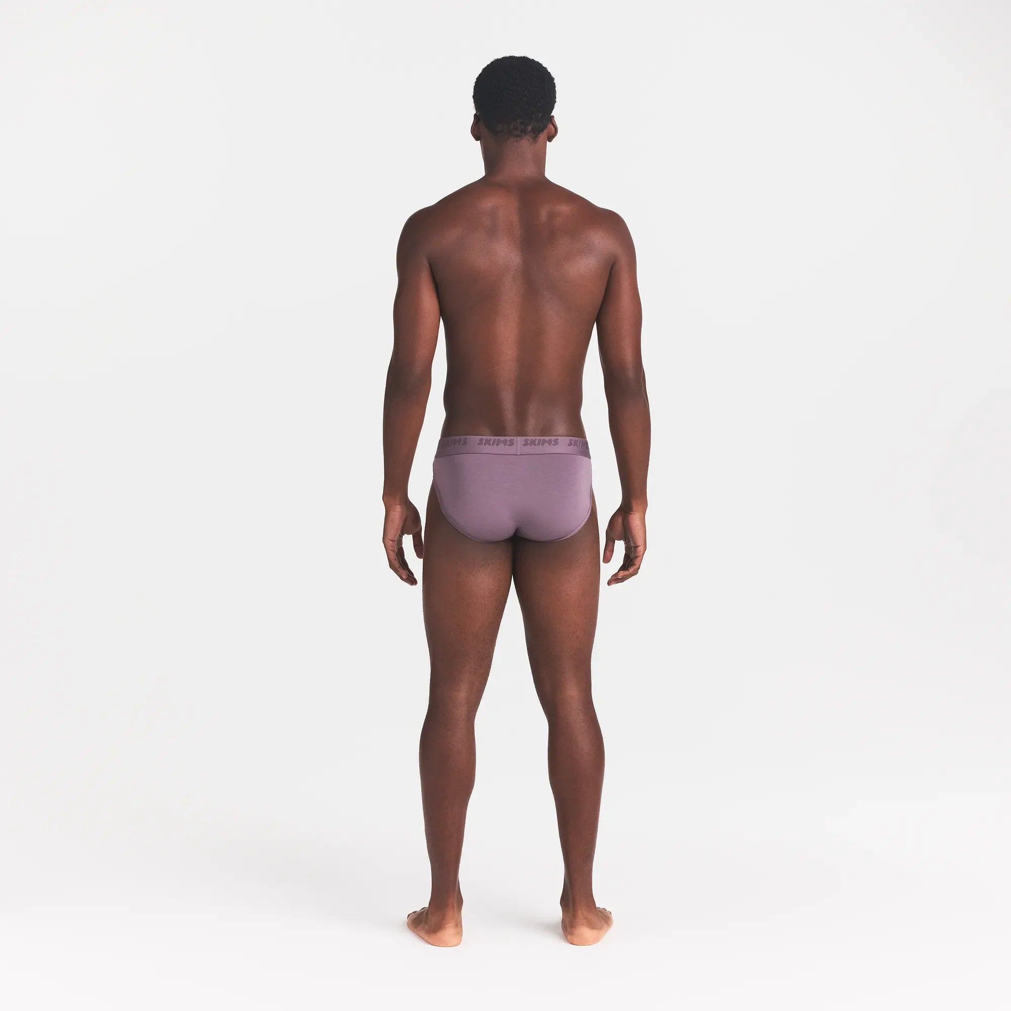 SKIMS STRETCH MENS BRIEF | IRIS ON A MODEL BACK VIEW @ | FOCUS: 0.0, 1.0, 0.9