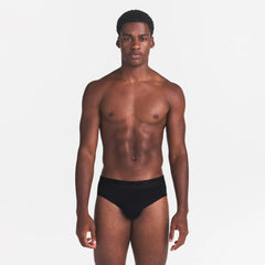 SKIMS STRETCH MENS BRIEF | OBSIDIAN ON A MODEL FRONT VIEW
