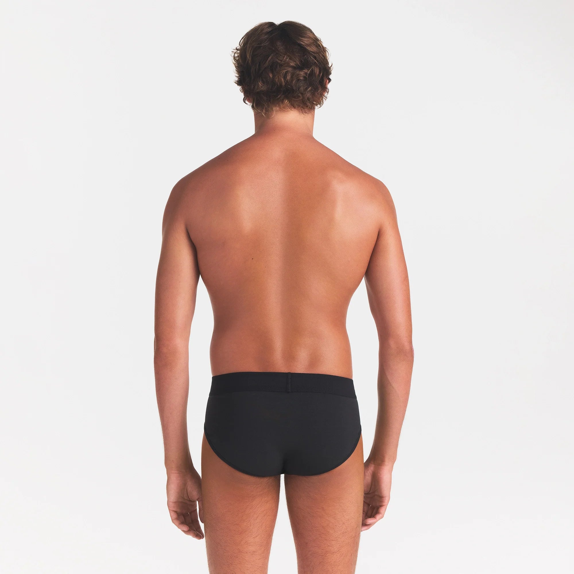 SKIMS COTTON MENS BRIEF 3-PACK | ONYX ON A MODEL BACK VIEW