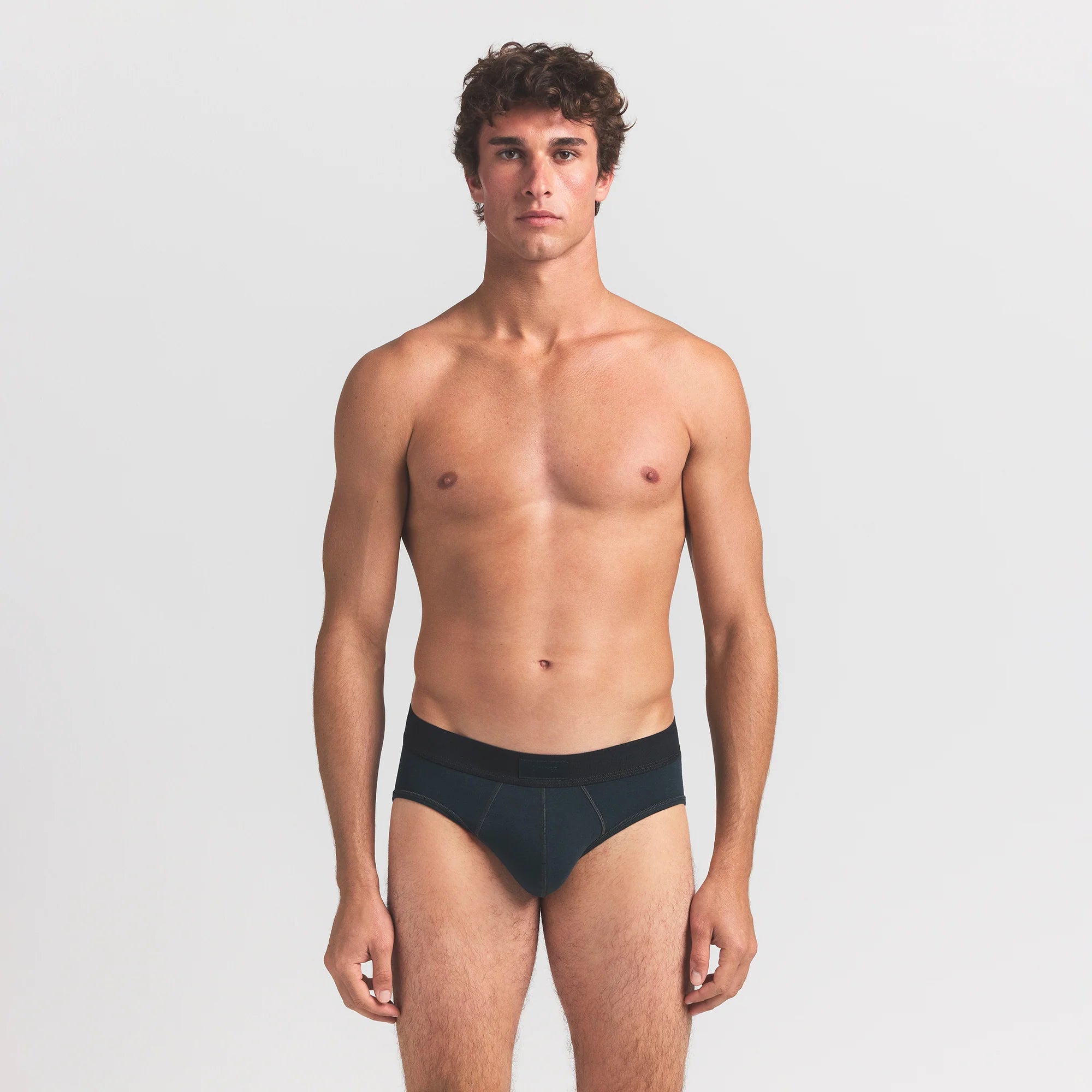 SKIMS COTTON MENS BRIEF 3-PACK | VERDANT MULTI ON A MODEL FRONT VIEW @ | FOCUS: 0.0, 1.0, 0.9