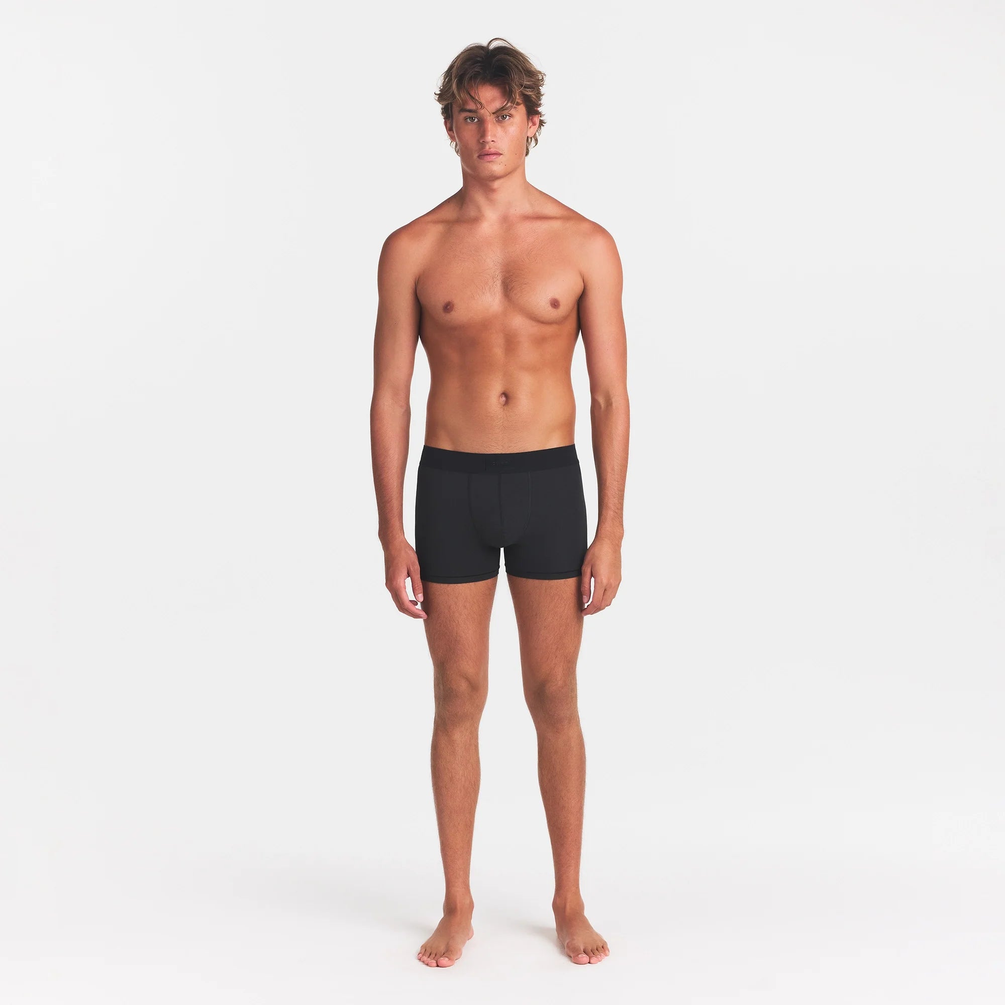 SKIMS COTTON MENS 3" BOXER BRIEF | ONYX ON A MODEL FRONT VIEW @ | FOCUS: 0.0, 1.0, 0.9