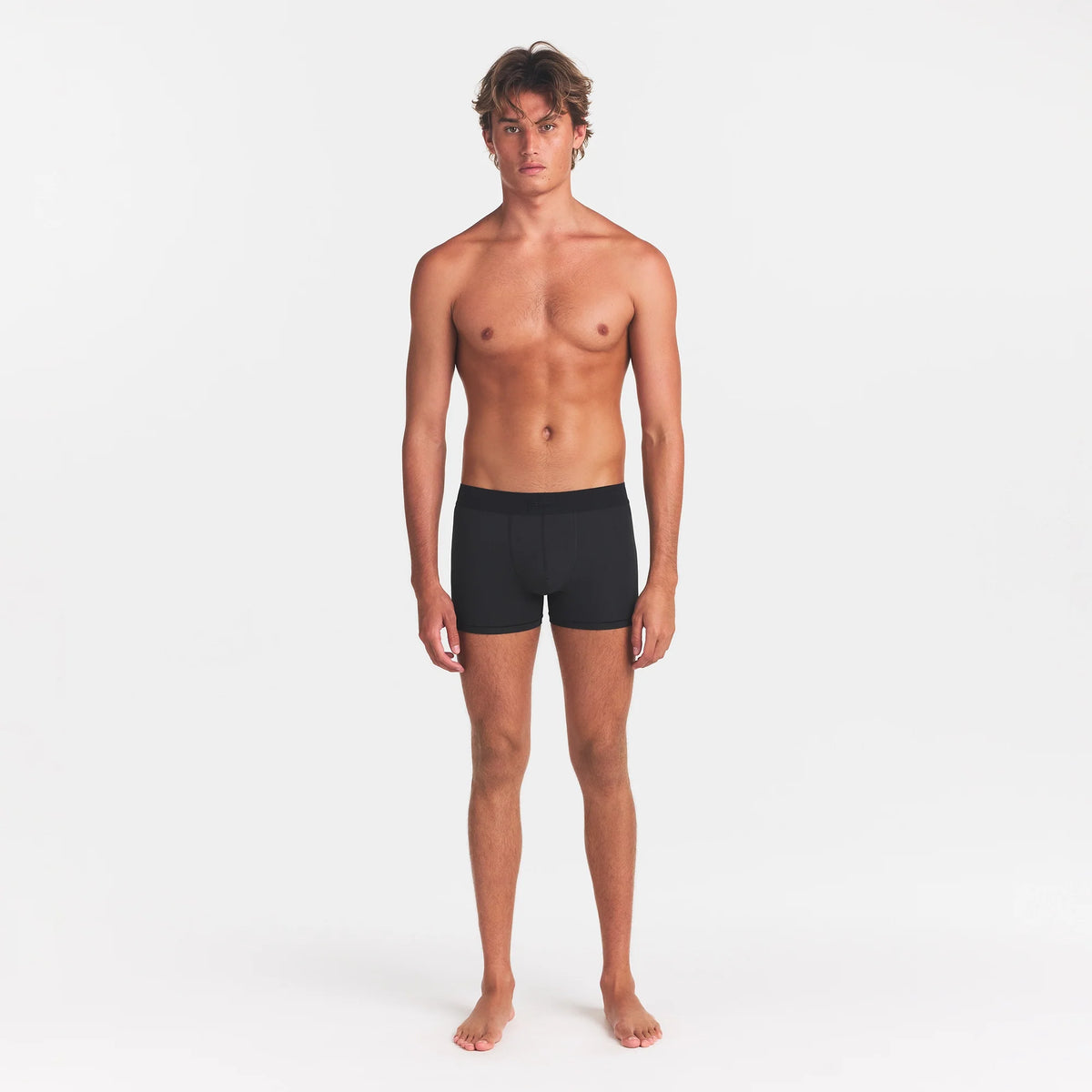 SKIMS COTTON MENS 3" BOXER BRIEF | ONYX ON A MODEL FRONT VIEW @ | FOCUS: 0.0, 1.0, 0.9