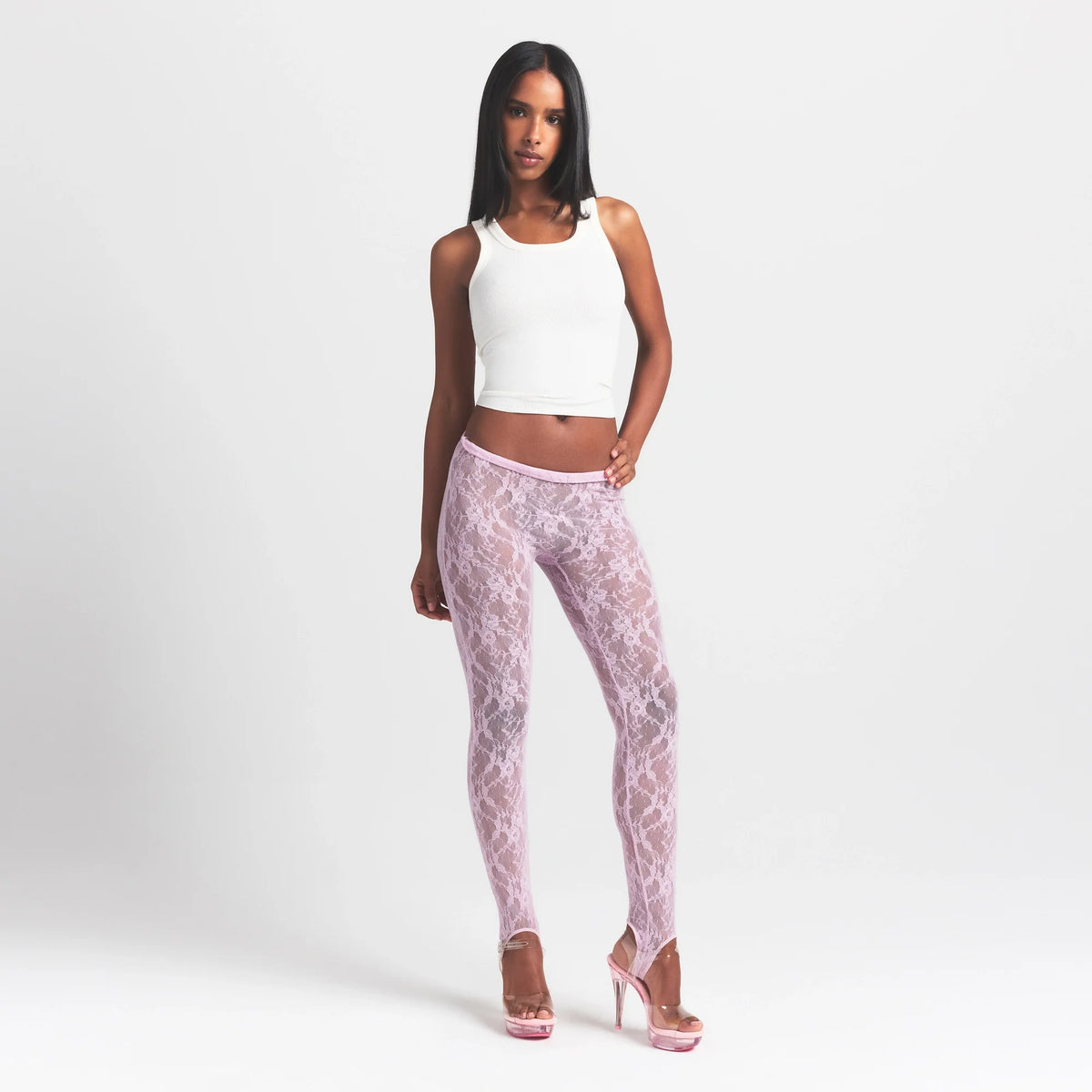 STRETCH LACE STIRRUP LEGGING | BABY PINK ON A MODEL FRONT VIEW @ | FOCUS: 0.0, 1.0, 0.9