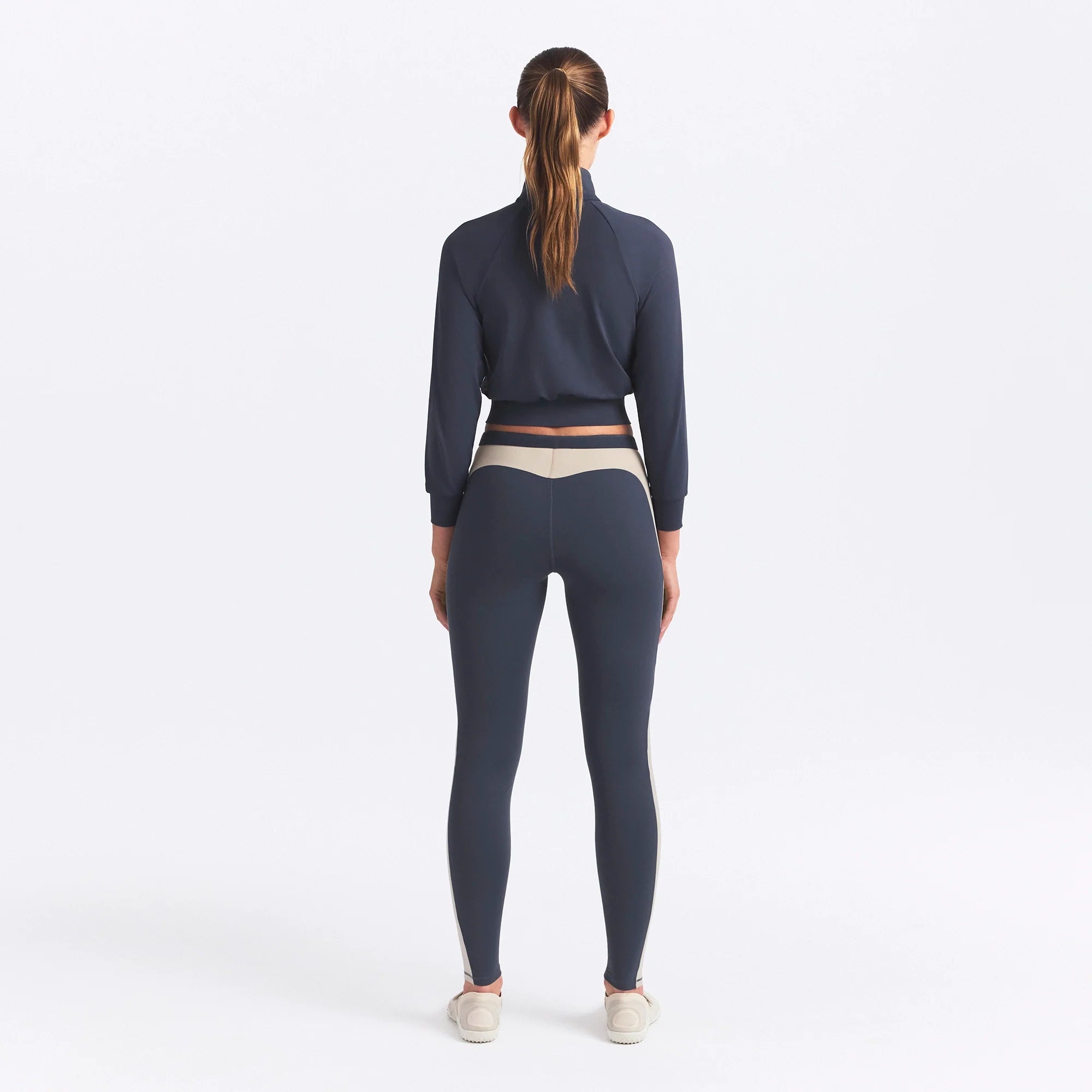 NikeSKIMS MATTE AND SHINE 26" LEGGING | DEEP ROYAL/STONE ON A MODEL SIDE VIEW @ | FOCUS: 0.0, 1.0, 0.9