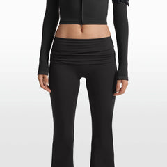 NikeSKIMS MATTE FOLDOVER SLIM FLARE LEGGING | OBSIDIAN ON A MODEL FRONT VIEW @ | FOCUS: 0.0, 1.0, 0.9