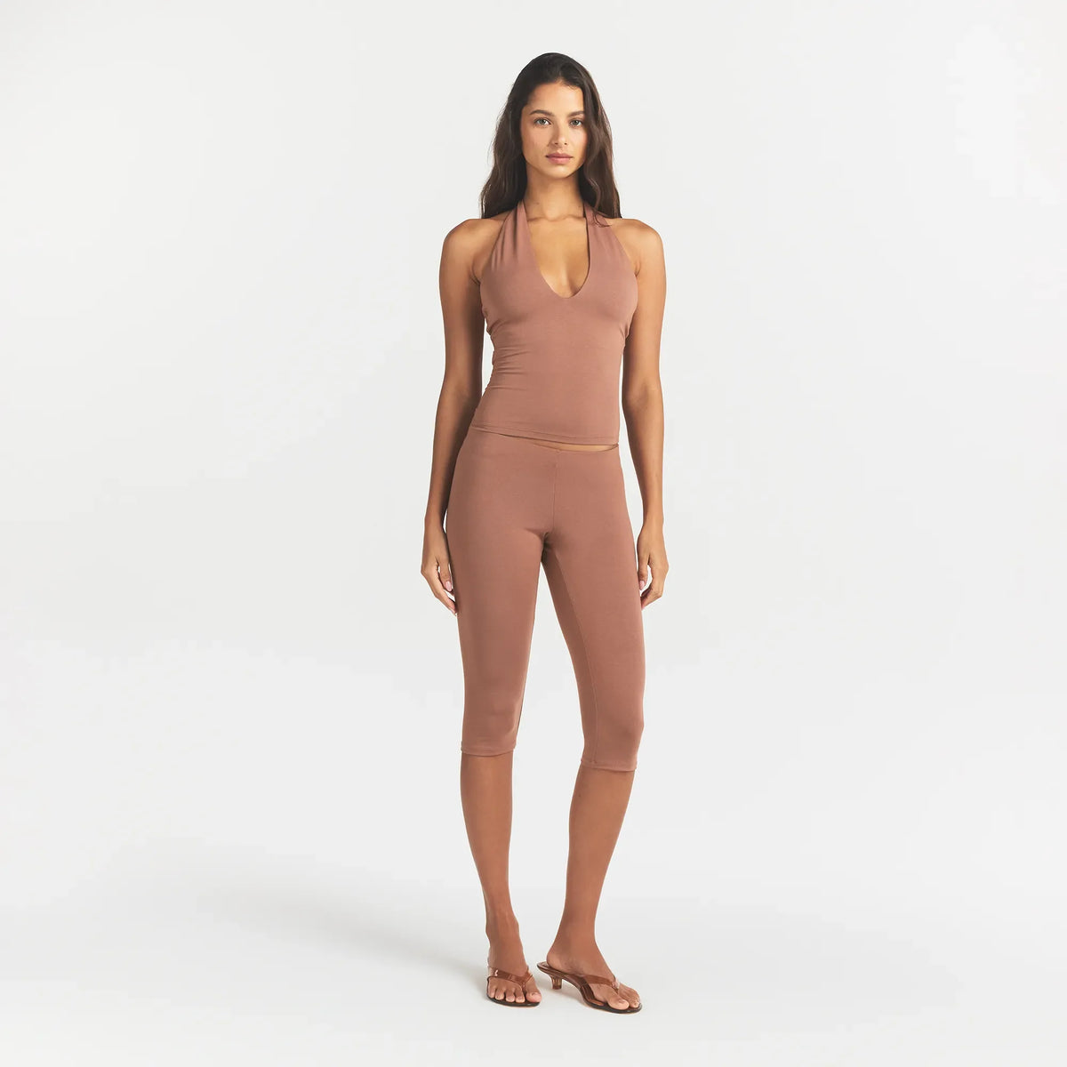 SMOOTH LAYERS HIGH-WAISTED CAPRI | NUTMEG ON A MODEL FRONT VIEW @ | FOCUS: 0.0, 1.0, 0.9