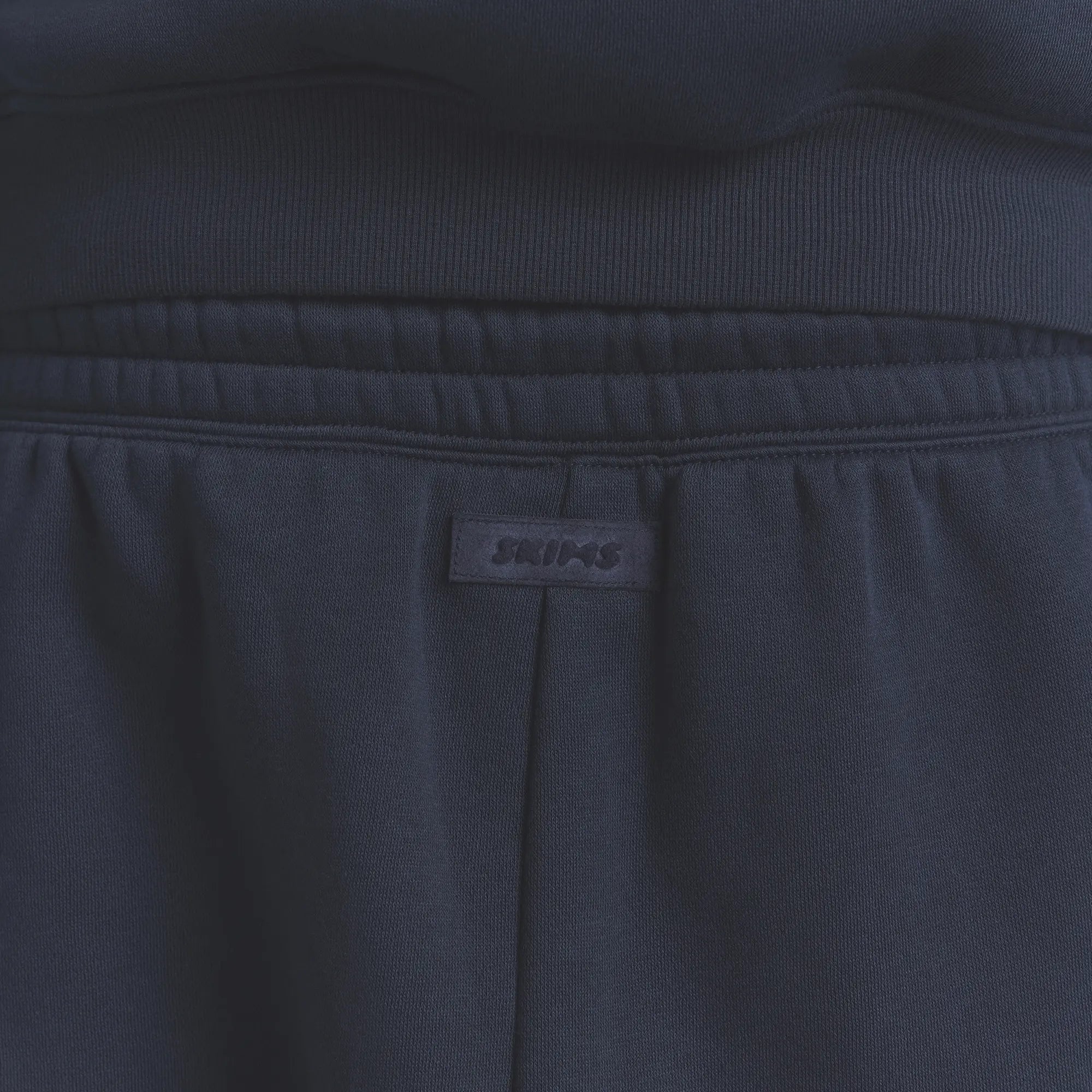 FLEECE LOUNGE MENS TAPERED JOGGER | NAVY ON A MODEL BACK VIEW @ | FOCUS: 0.0, 1.0, 0.9