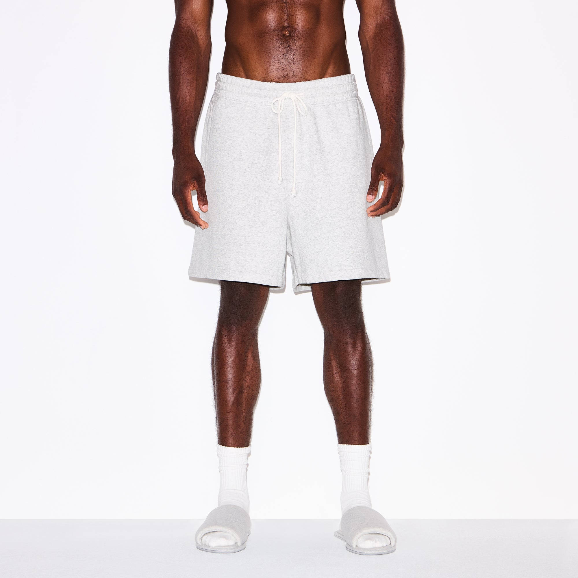 FLEECE LOUNGE MENS RELAXED SHORT | LIGHT HEATHER GREY ON A MODEL SIDE VIEW @ | FOCUS: 0.0, 1.0, 0.9