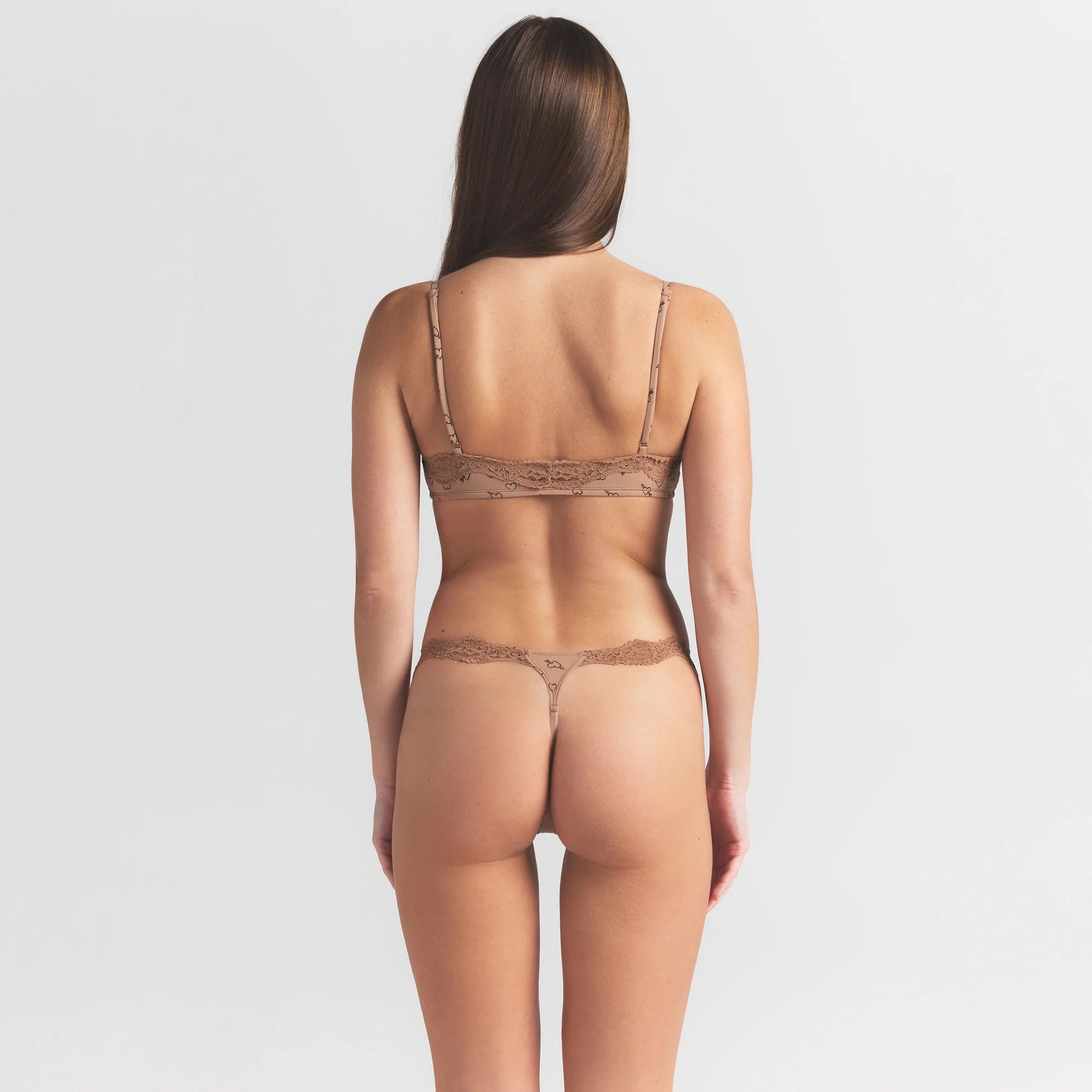 FITS EVERYBODY LACE SCOOP BRALETTE 2-PACK | ONYX AND SKETCHED HEARTS ON A MODEL SIDE VIEW @ | FOCUS: 0.0, 1.0, 0.9