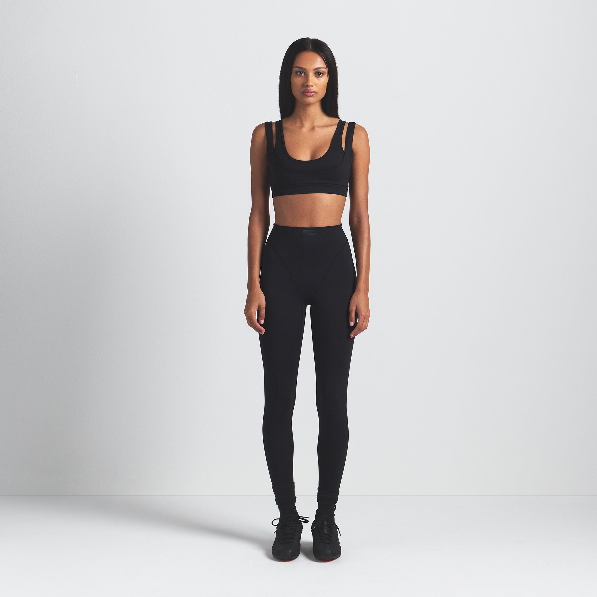 NikeSKIMS MATTE DOUBLE STRAP SCOOP BRA | OBSIDIAN ON A MODEL FRONT VIEW