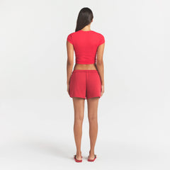 COTTON FLEECE CLASSIC SHORT | WASHED RED ON A MODEL SIDE VIEW @ | FOCUS: 0.0, 1.0, 0.9