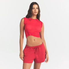 COTTON FLEECE CLASSIC SHORT | WASHED RED ON A MODEL SIDE VIEW @ | FOCUS: 0.0, 1.0, 0.9